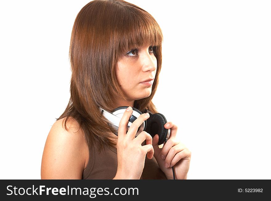 The girl in brown with headphones on a white background