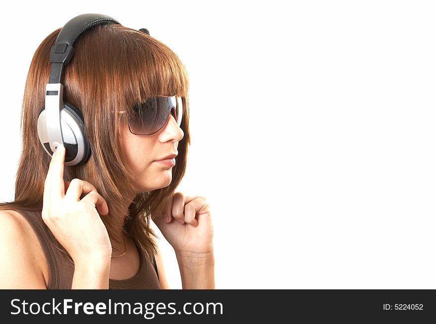 The girl in brown with headphones on a white background