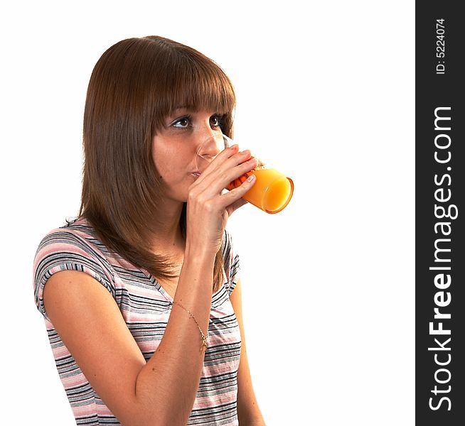 The girl drinking juice on a white background