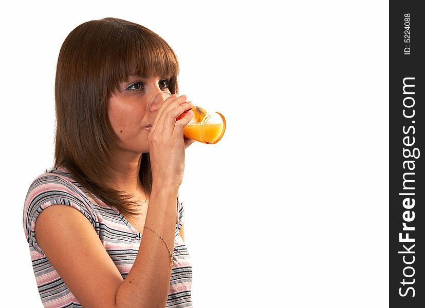 The girl drinking juice on a white background