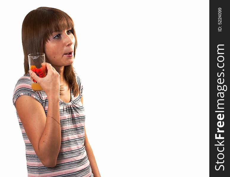 The girl drinking juice on a white background