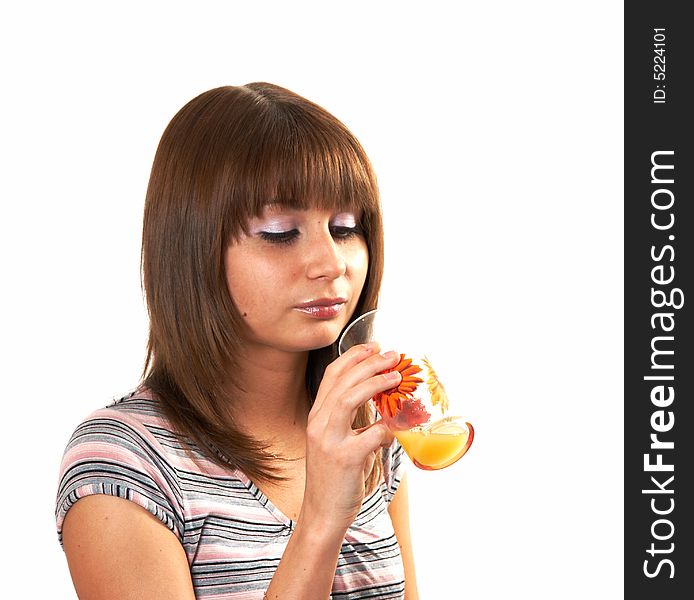 The girl drinking juice on a white background