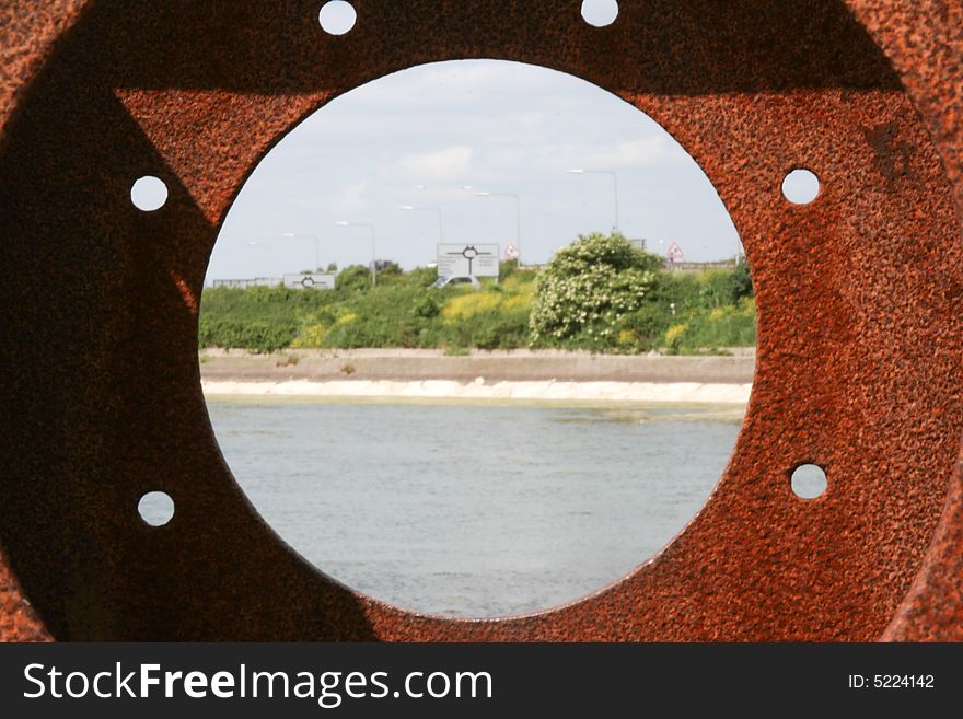 Looking through a rusty porthole with the center with a Sharp DOF Cose up. Looking through a rusty porthole with the center with a Sharp DOF Cose up