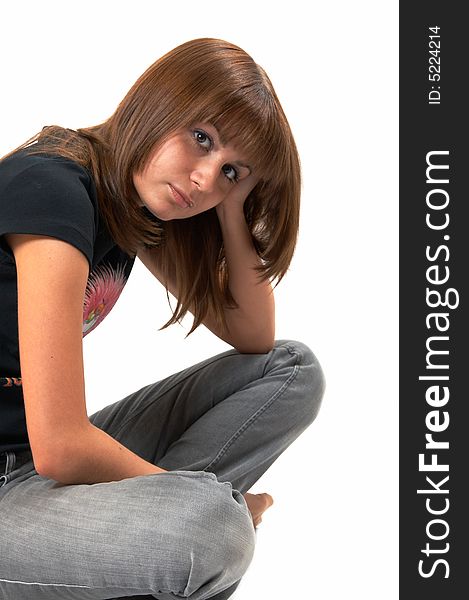 Girl In A Black Vest Sits On A Floor