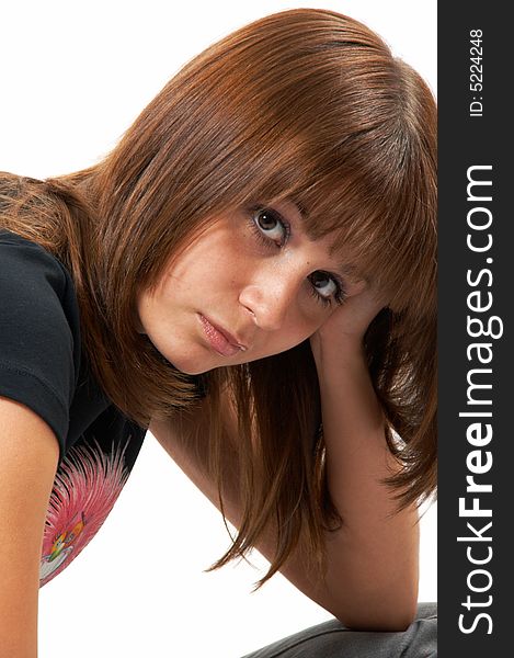 Girl In A Black Vest Sits On A Floor