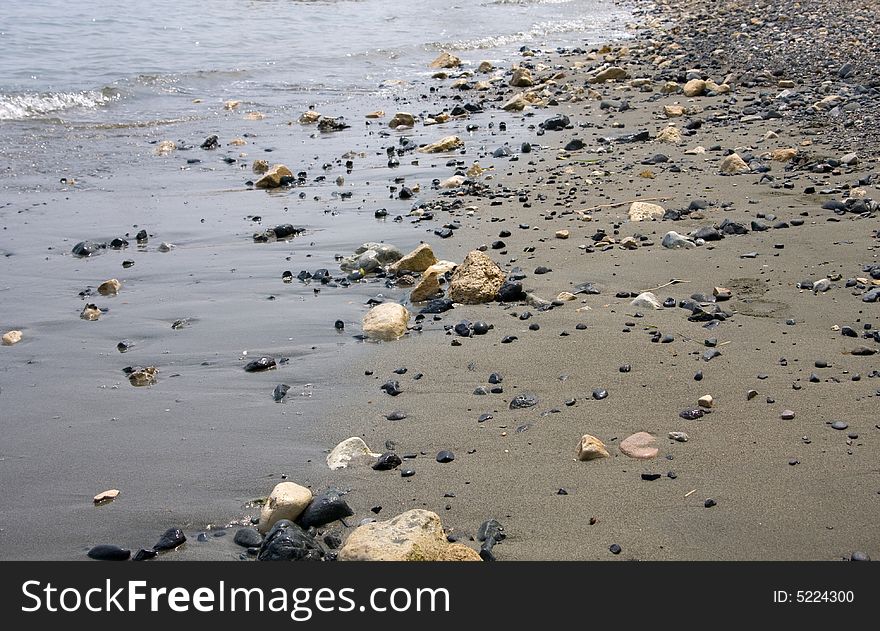 Stones on sand, coast, sea