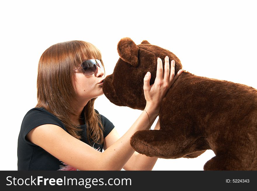 The girl with the teddy bear on a white background