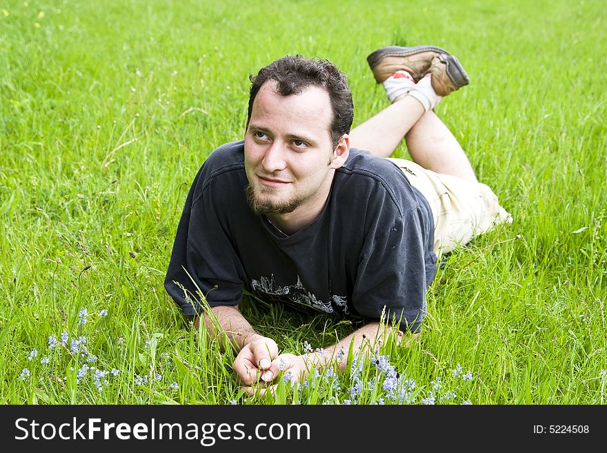 Young Man Laying In Grass