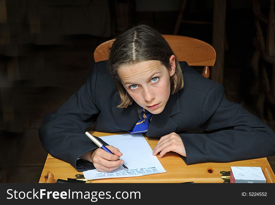 Interior portrait of girl doing homework. Interior portrait of girl doing homework