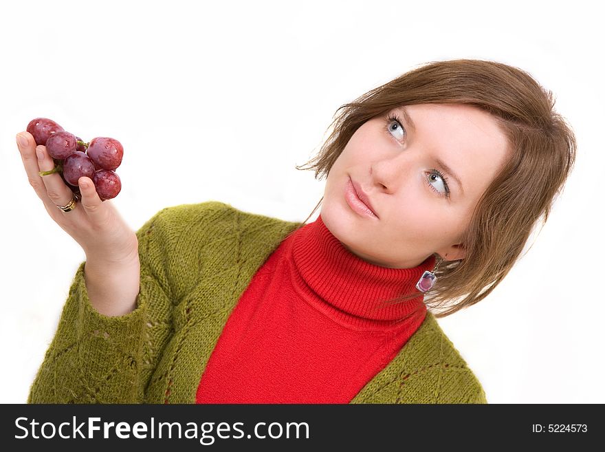 Young girl is holding grapes in the palm