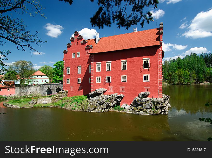 Castle Cervena Lhota built in manor house style on little island surrounded by water in south part of the Czech Republic