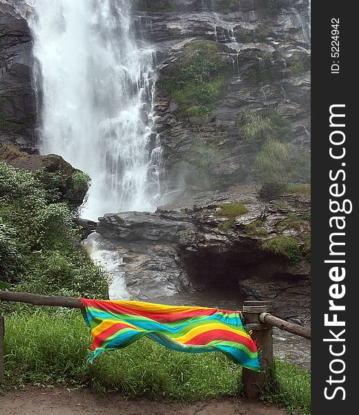 Colorful cloth hanging in waterfall