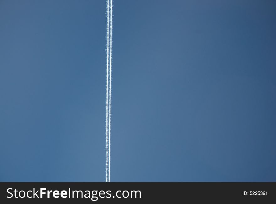 A contrail or vapour trail high in the Californian sky
