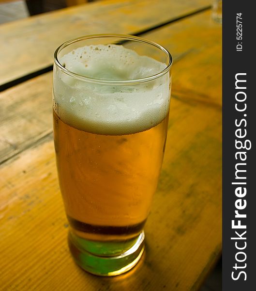 Cold beer in glass on the table