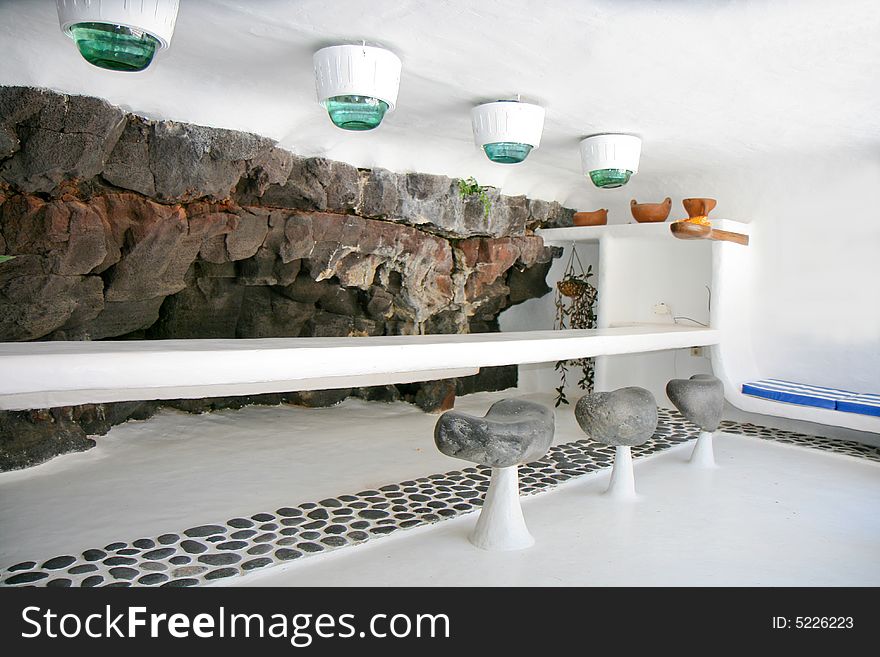 Picture of a bar with rock wall which is built into a cave. Picture of a bar with rock wall which is built into a cave