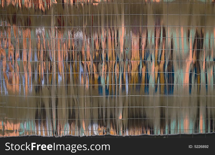 Abstract created by a wire grid enclosing a reflective material. Abstract created by a wire grid enclosing a reflective material