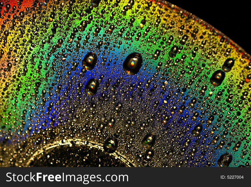 Abstract view of CD covered with water drops. Abstract view of CD covered with water drops