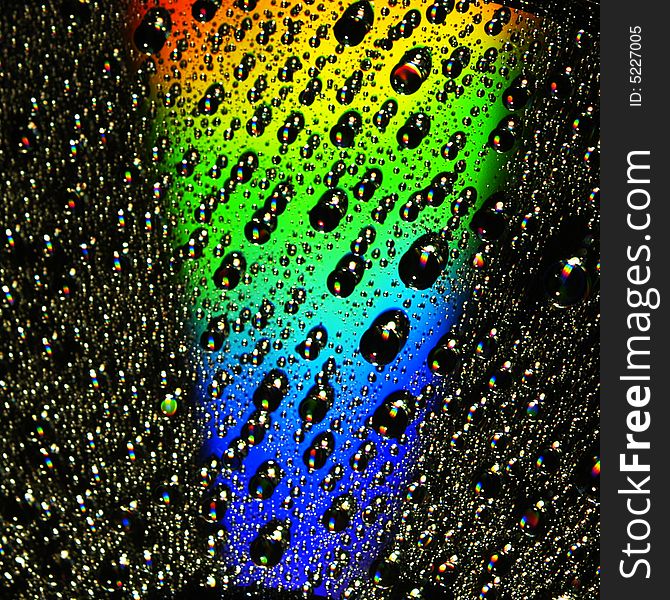 Abstract view of CD covered with water drops. Abstract view of CD covered with water drops