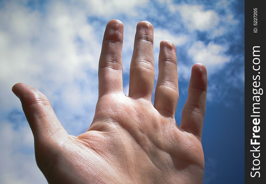 The palm of a hand pointed to the sky as a cry for help. The palm of a hand pointed to the sky as a cry for help