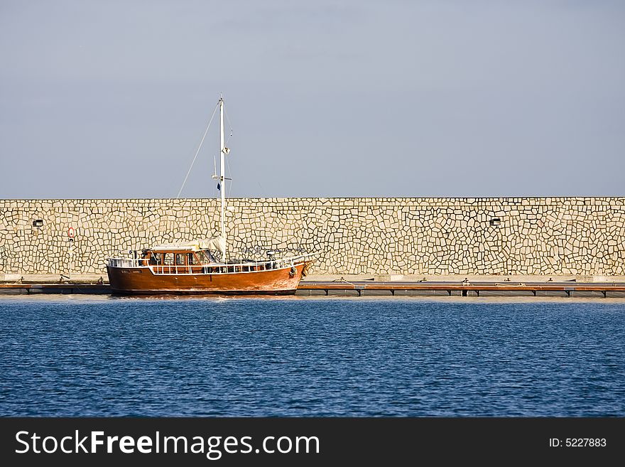 Wooden little yatch docked at port. Wooden little yatch docked at port