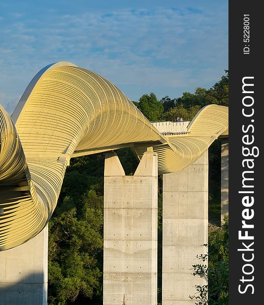 Bridge over a high valley with a sinuous curve design at dawn. Bridge over a high valley with a sinuous curve design at dawn