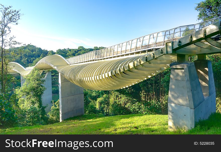 Bridge over a high valley with a sinuous curve design at dawn. Bridge over a high valley with a sinuous curve design at dawn