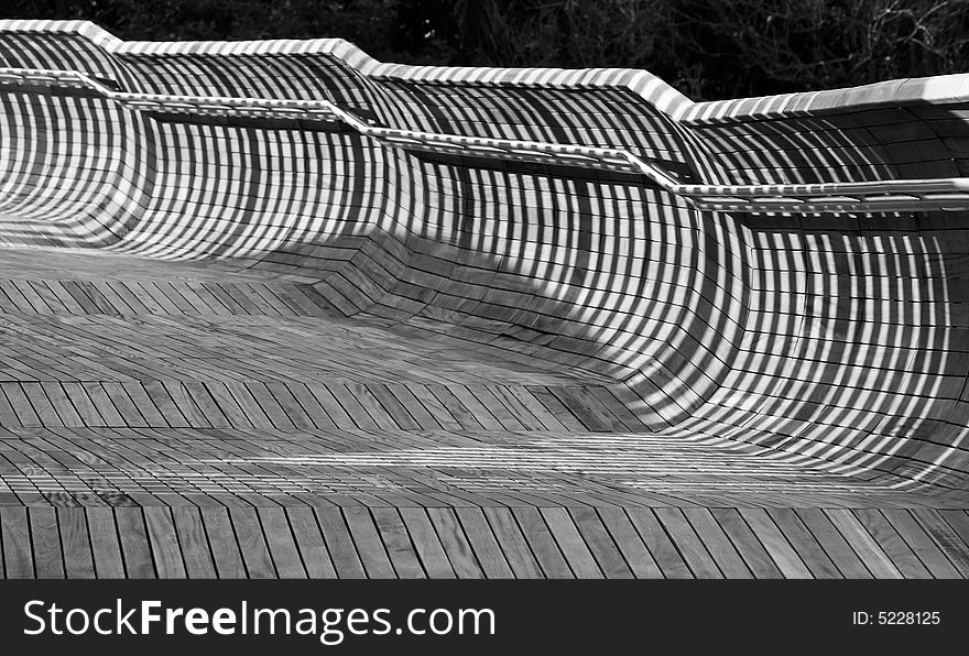 Shadows cast on boardwalk in the morning. Shadows cast on boardwalk in the morning