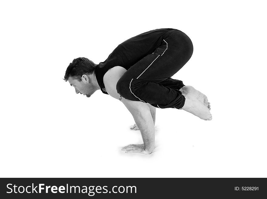 Young male gymnast practicing yoga. Young male gymnast practicing yoga.
