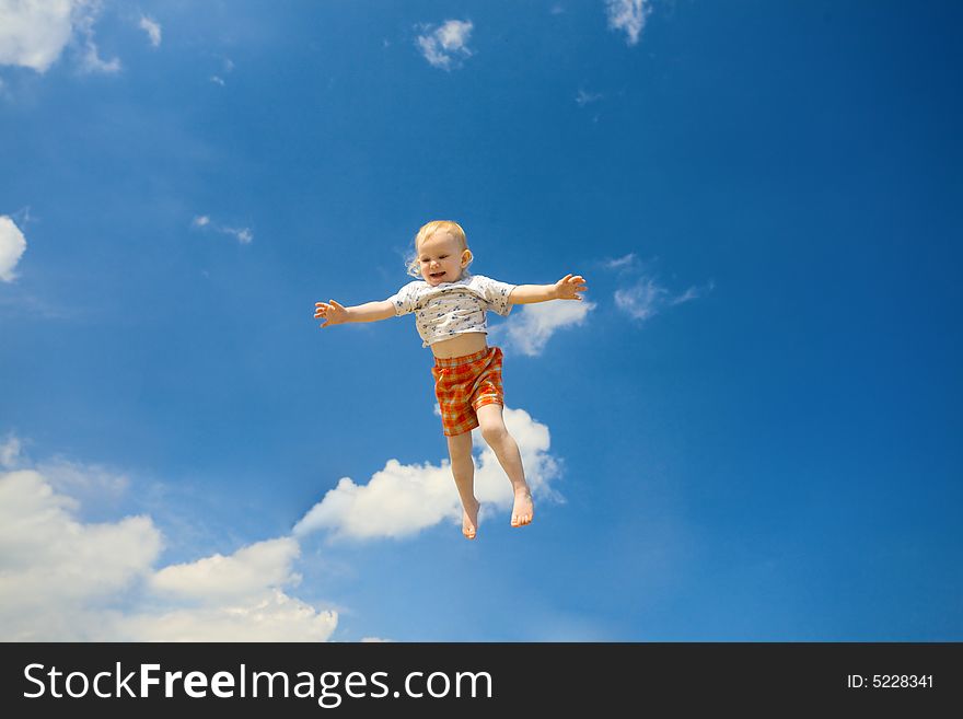 Happy child fly in the sky