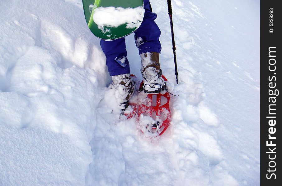 Man climb with snow shoes