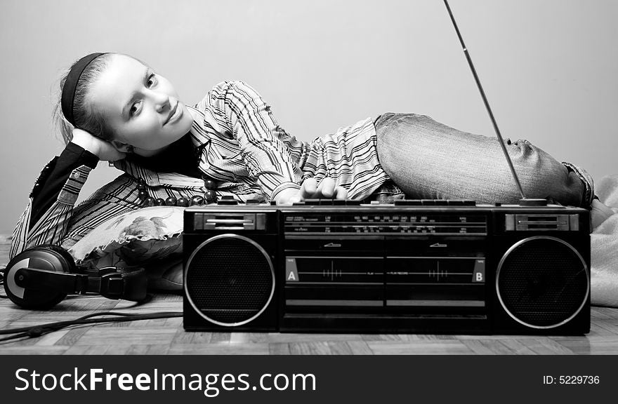 Young woman is listening radio