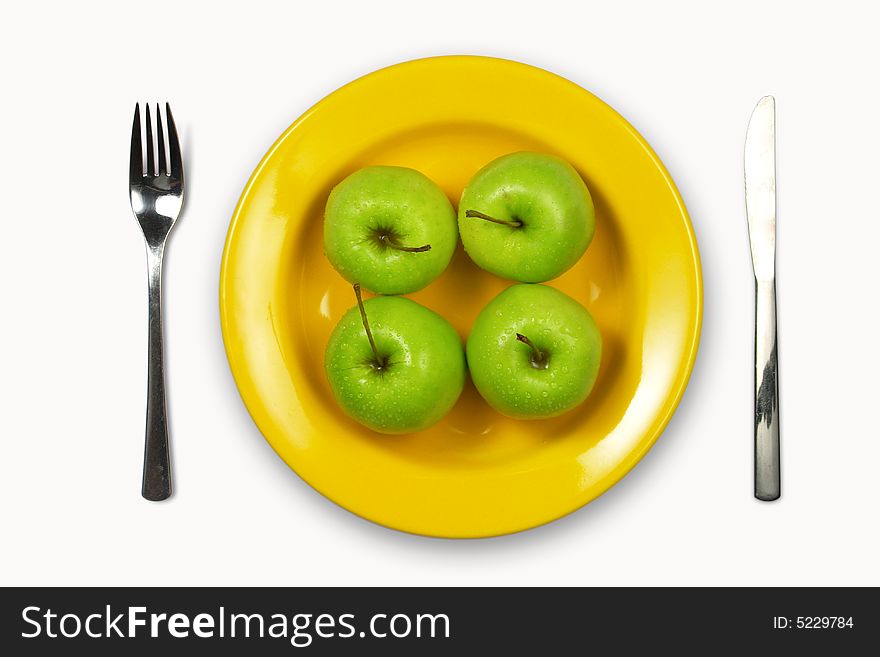 Apples on yellow plate