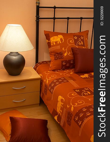 Modern bedroom with red bedspread and pillow. Modern bedroom with red bedspread and pillow