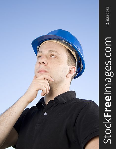 Male thinks while working on a real estate project. Male thinks while working on a real estate project