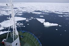 Cargoship Entering Icefield Stock Photos
