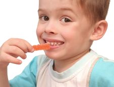 The Boy Eats Fruit Candy On A White Background Royalty Free Stock Photo The Boy Eats Fruit Candy On A White Background Royalty Free Stock Photo