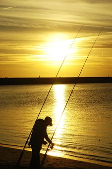 Fisherman At Beach Sunset Royalty Free Stock Photos Fisherman At Beach Sunset Royalty Free Stock Photos