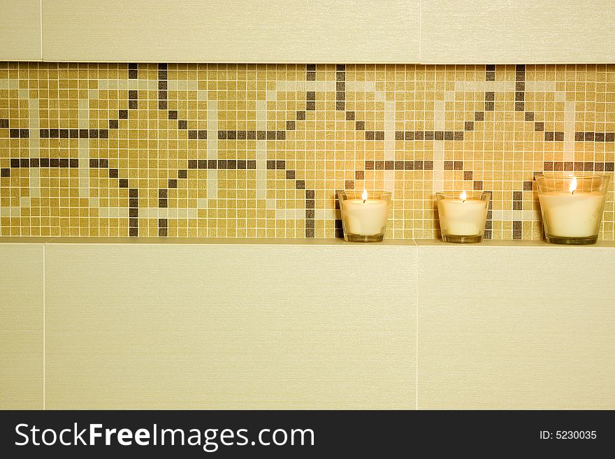 Detail of brown modern bathroom with candle