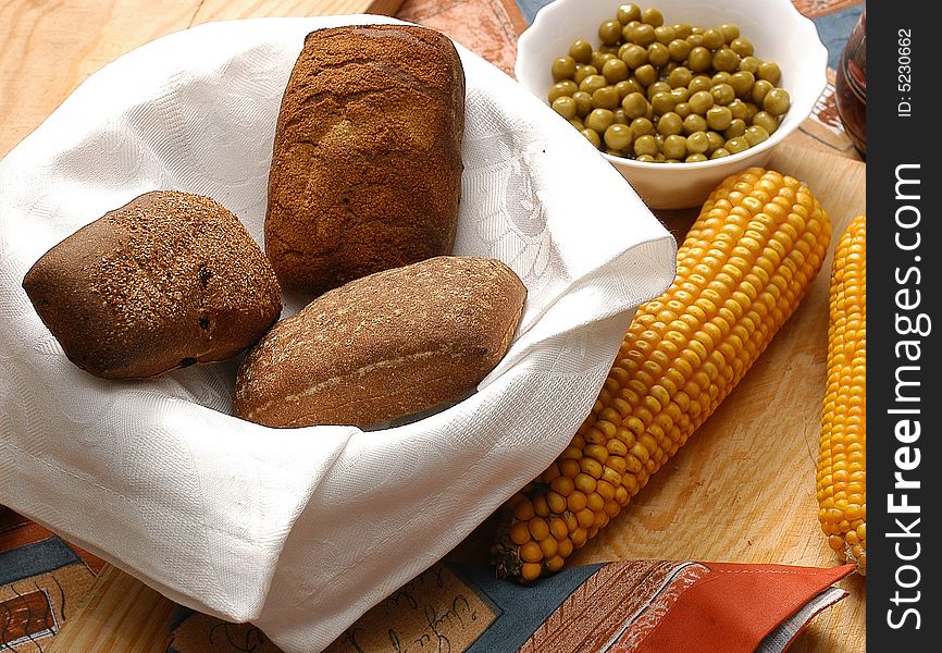 Appetizing rolls of bread with corn