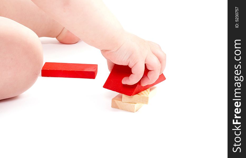 Child playing toys isolated on white