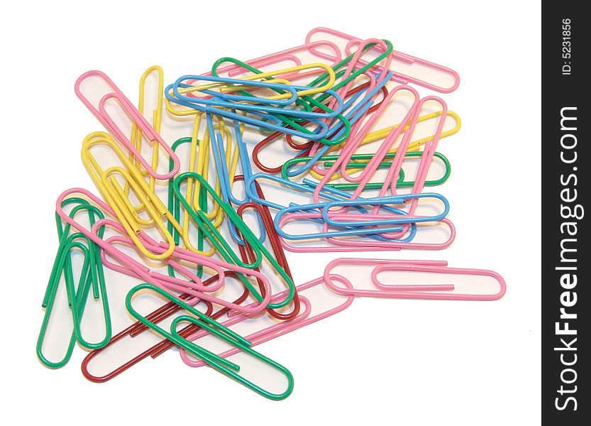 Multi-colored paper clips on a white background. Multi-colored paper clips on a white background