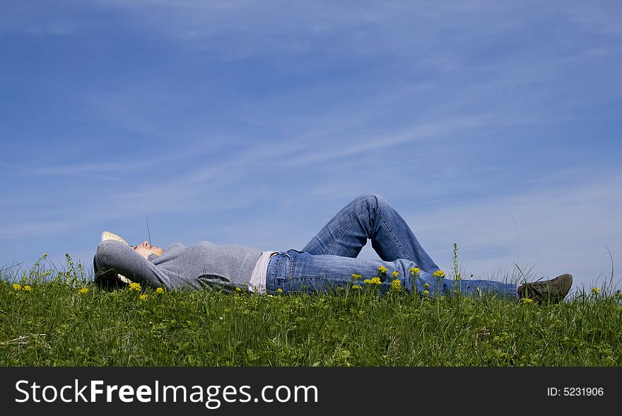 Young girl laying in grass. Young girl laying in grass