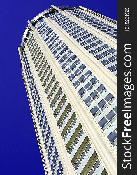 Fragment of high-tech building against the sky