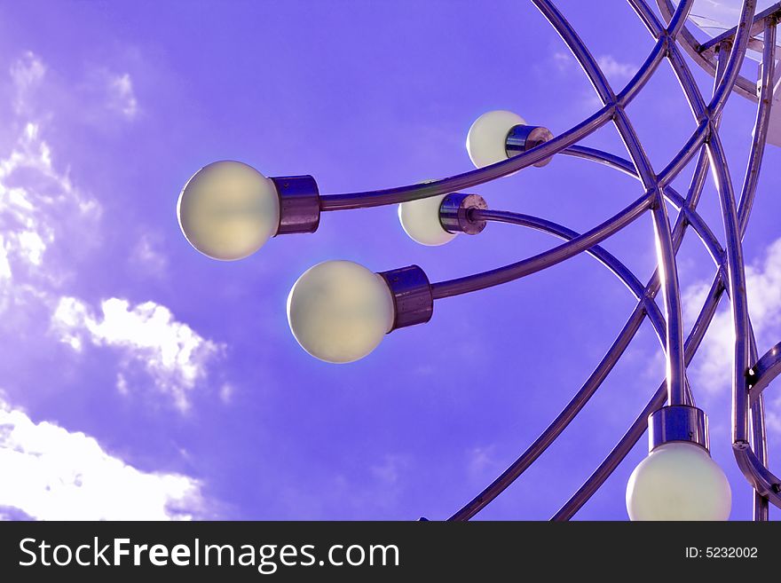 High-tech street lamps over sky background