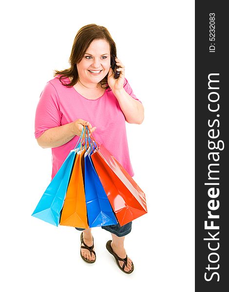 Pretty plus-sized woman holding her shopping bags and talking on the phone. Full body isolated on white. Pretty plus-sized woman holding her shopping bags and talking on the phone. Full body isolated on white.