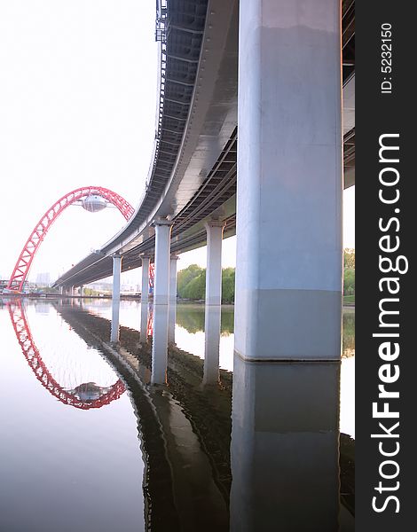 New highway bridge with reflection in water