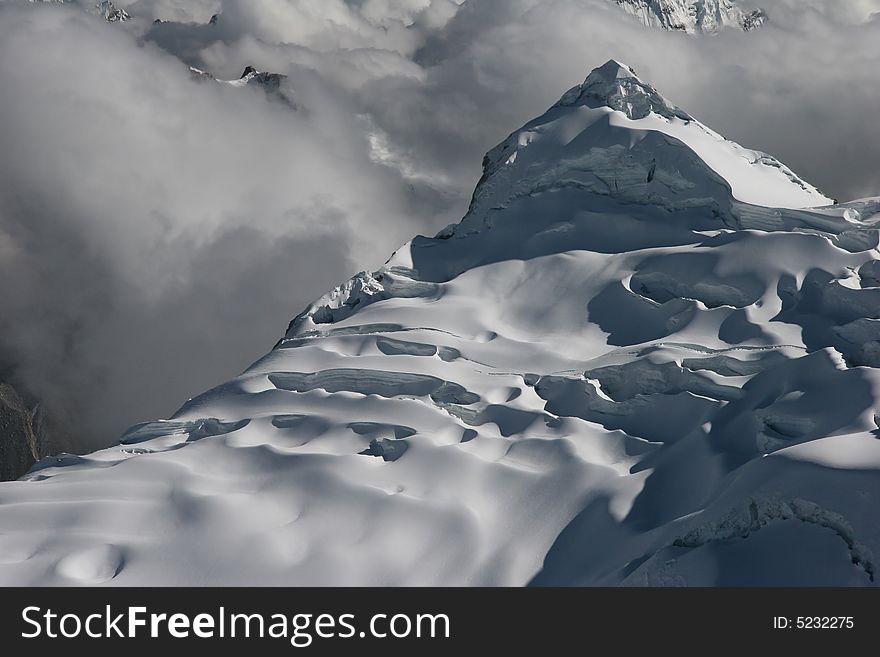 View from top of mountain Vallunaraju (5.686 m), in background Huascaran, Andes, Peru. View from top of mountain Vallunaraju (5.686 m), in background Huascaran, Andes, Peru