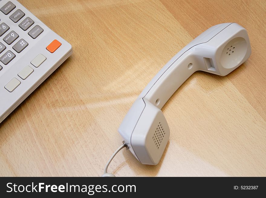 Telephone receiver laying on the table