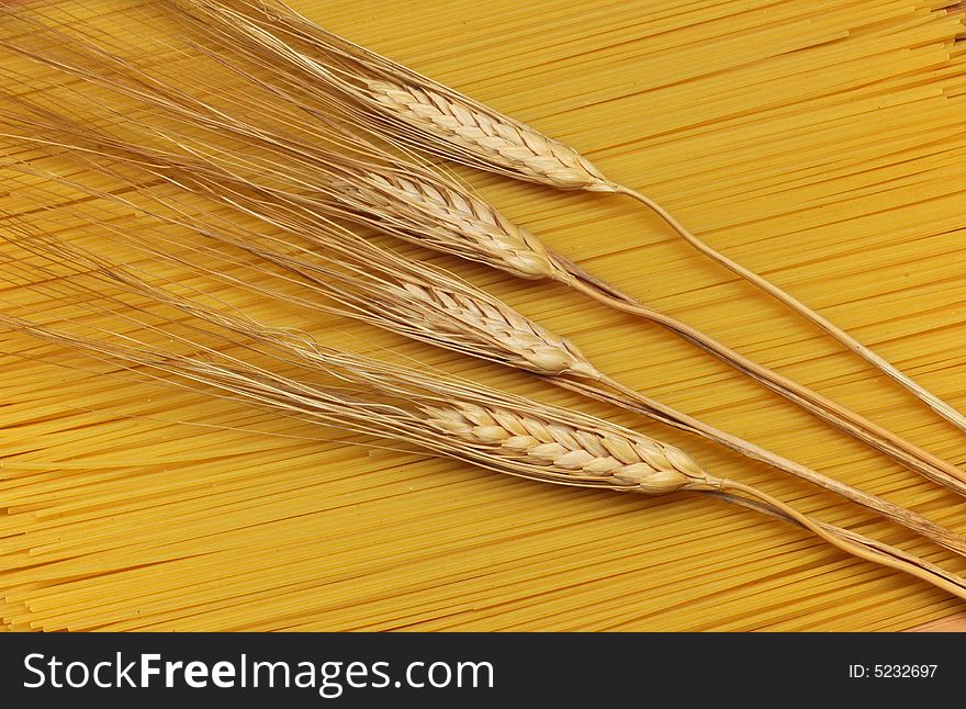 Food background with spaghetti and spikelets. Food background with spaghetti and spikelets