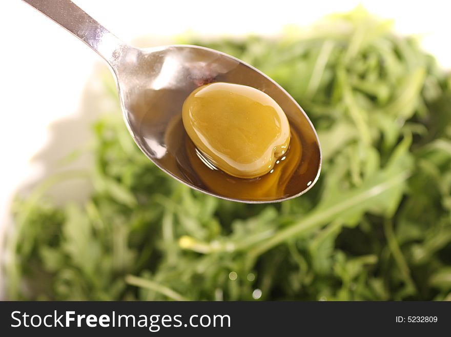 Olive with Olive oil and a rucola salad.